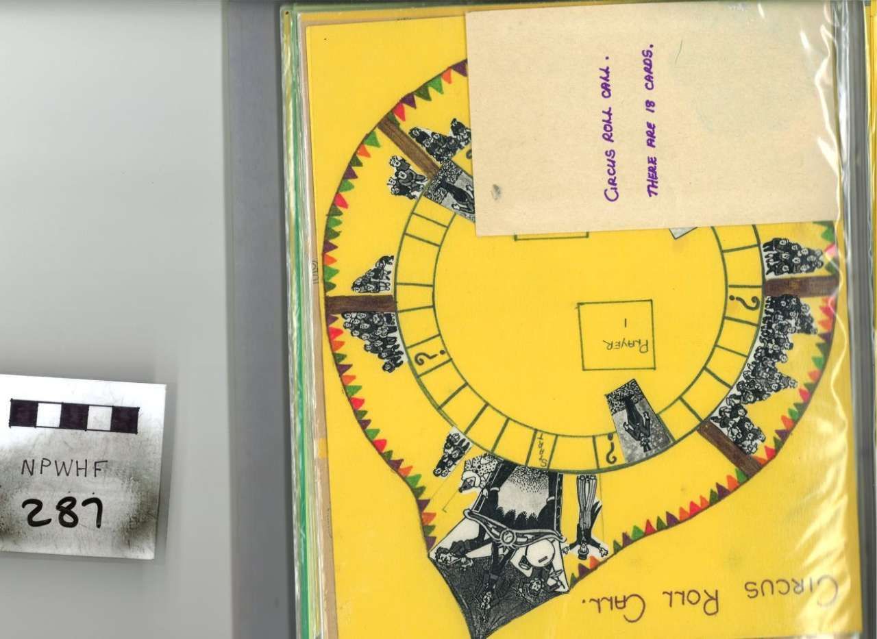 Yellow circular chart with notes on gray surface next to small paper label marked 287