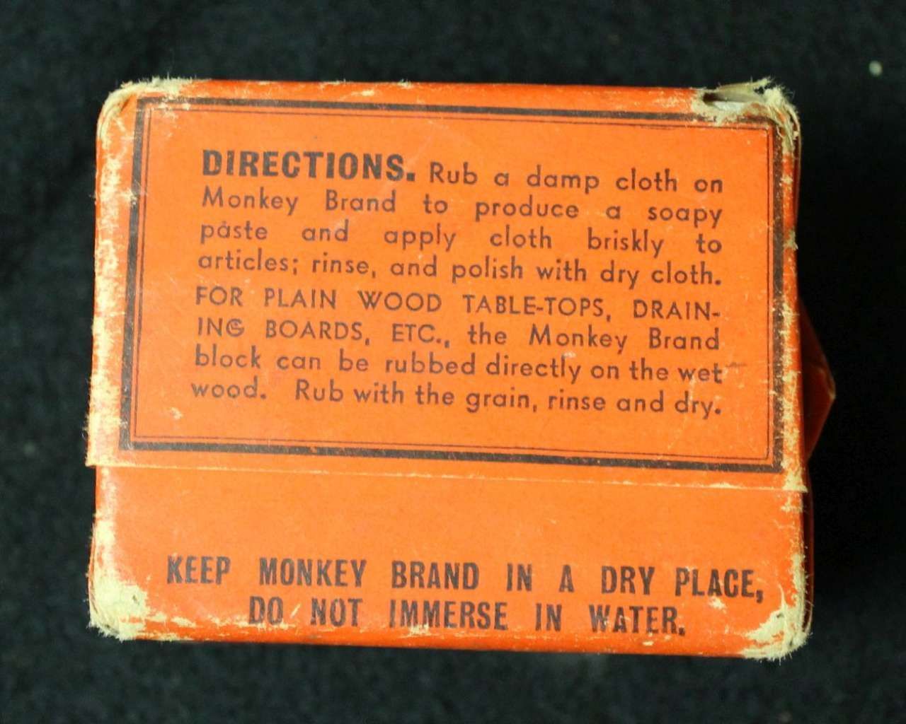 Orange Monkey Brand box with printed directions and warning text on the front side.