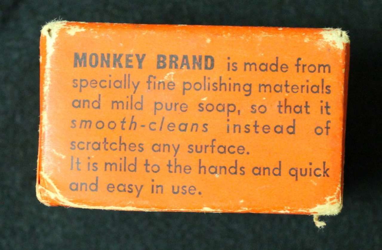 Orange Monkey Brand soap label with text on a dark background