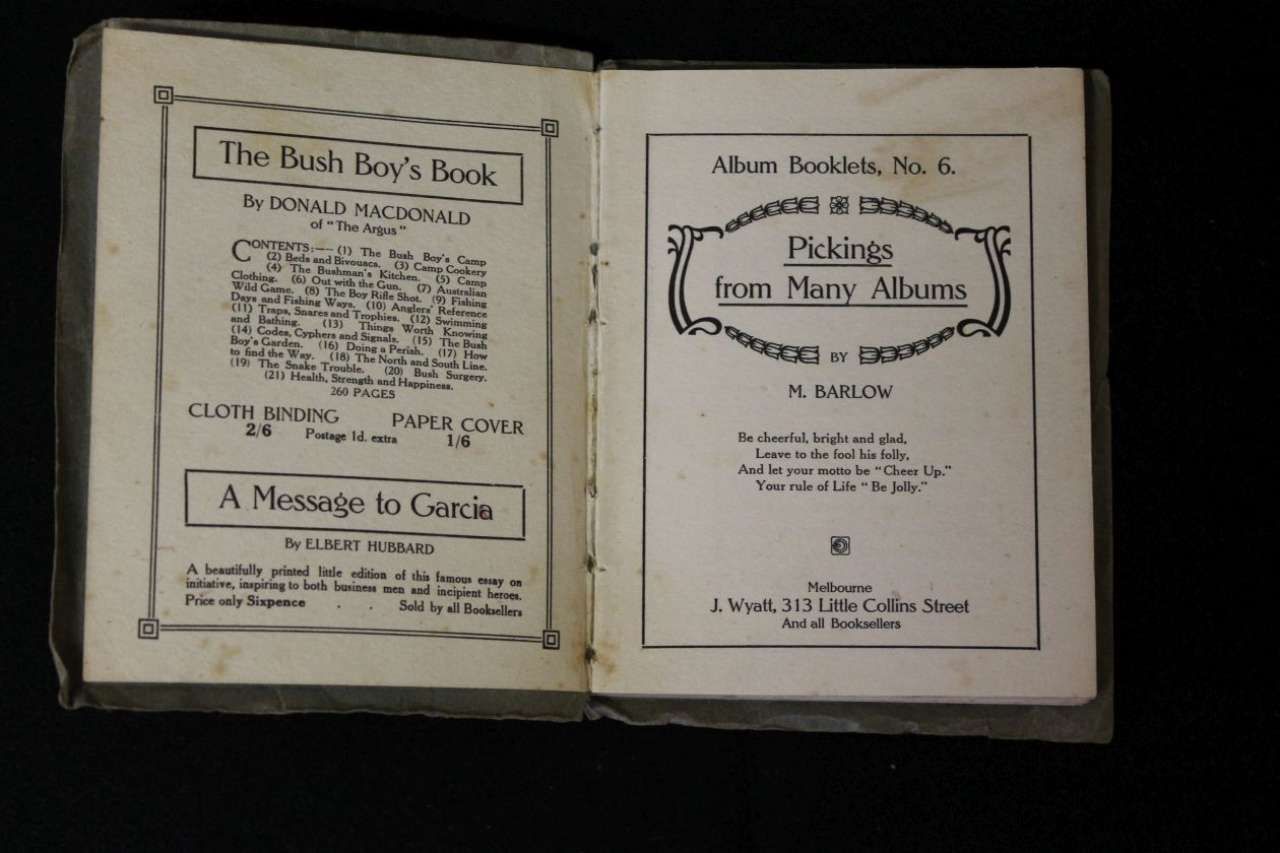 Open book showing title pages of two old books, one about boys and one about Indian boys.