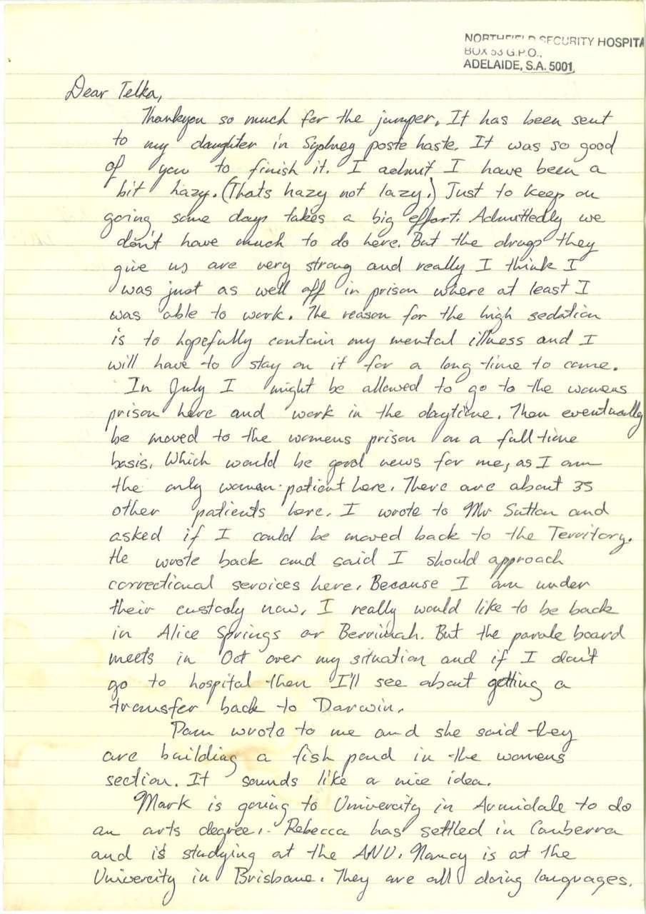 Handwritten letter on yellow lined paper, filled with cursive text.