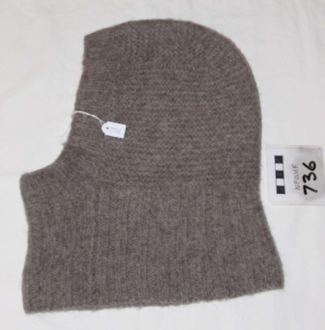Brown knitted balaclava ski mask with eye opening, lying flat on a white background.