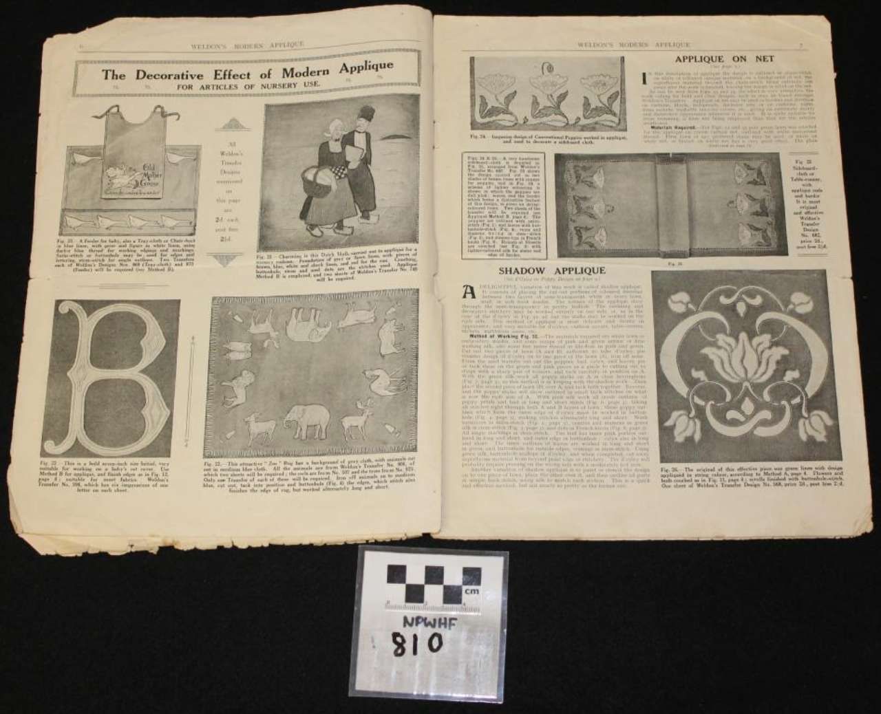 Two-page newspaper spread with black-and-white illustrations and decorative medieval-style letterforms on a dark background