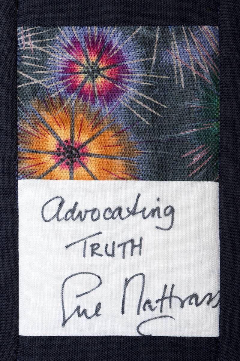 Handwritten note reading “Advocating Truth” with a colorful fireworks design above it