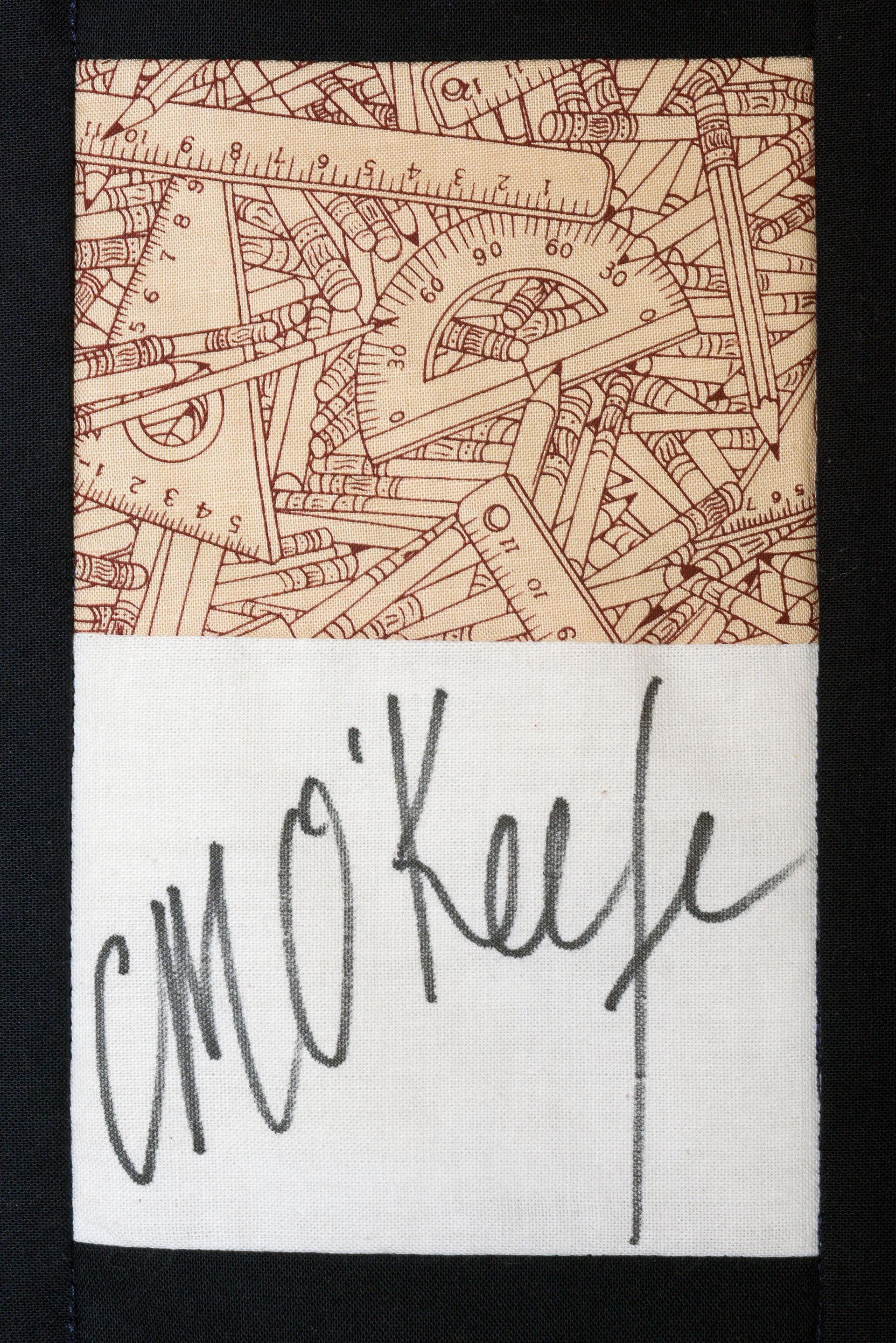 Two-panel image: tan patterned fabric above, white cloth below with handwritten “CMO Keye” signature