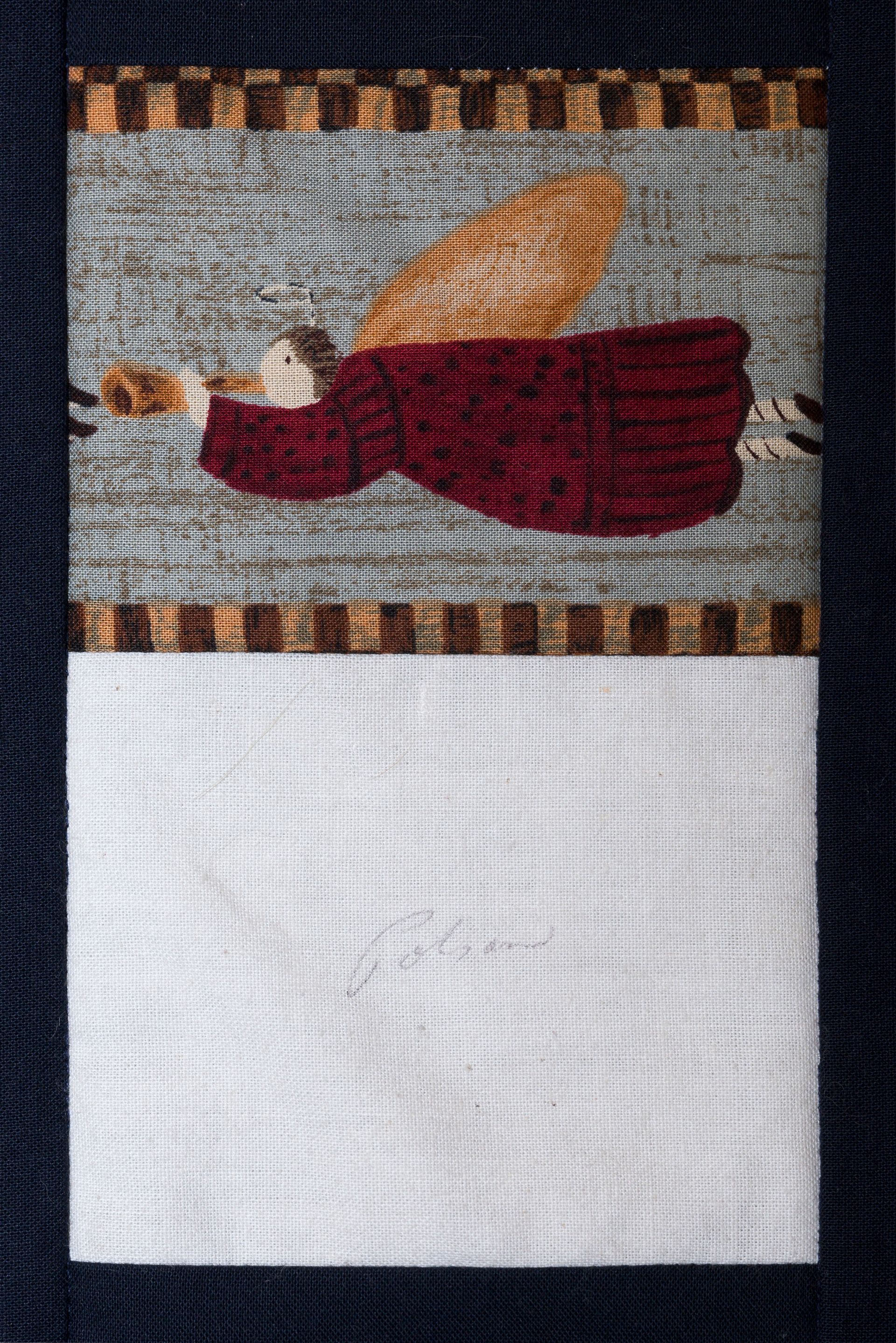 A woven bottle motif on a textile, with a red bottle and tan wing above a white lower panel.