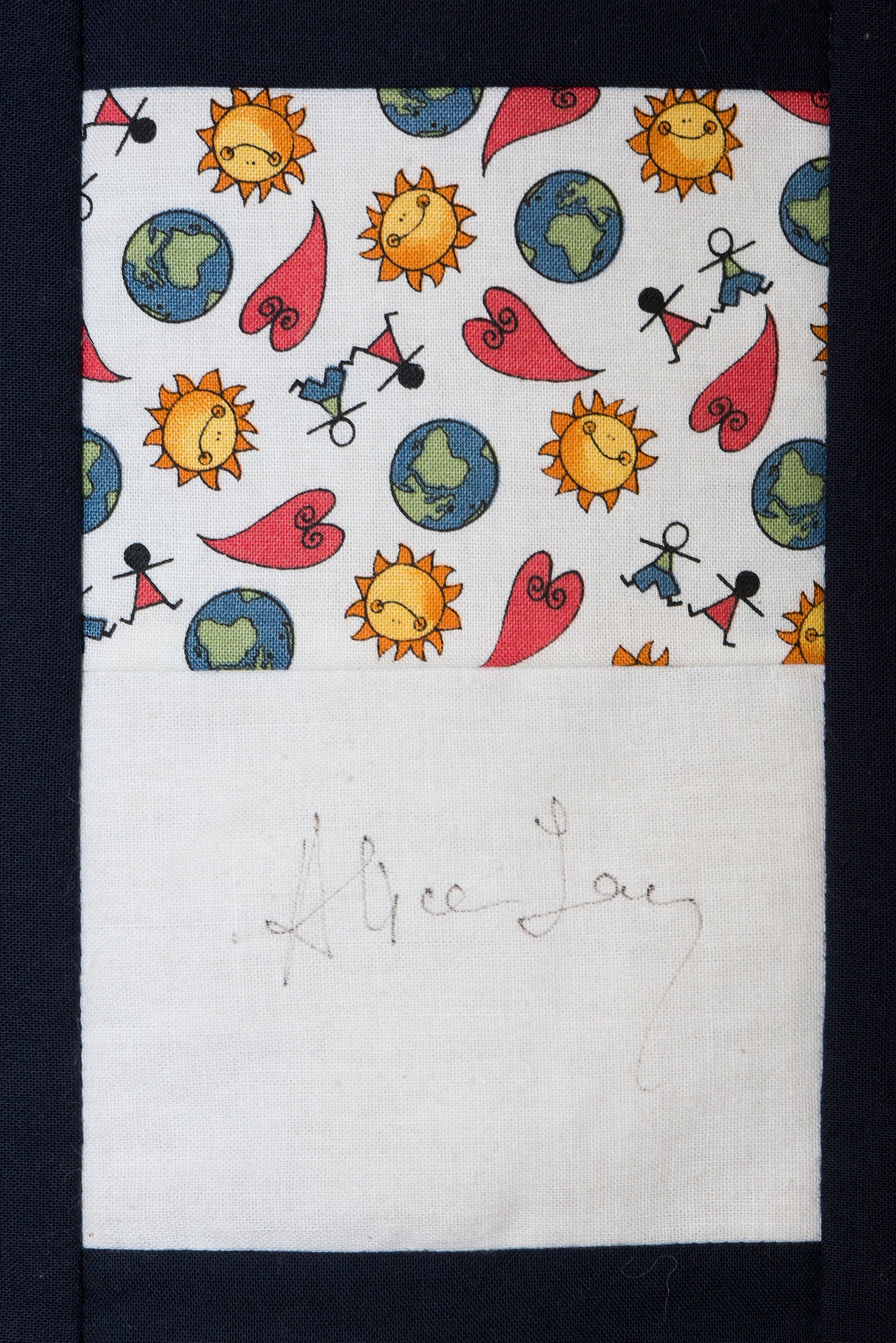 Patterned paper with sun, Earth, and red birds above a blank white area