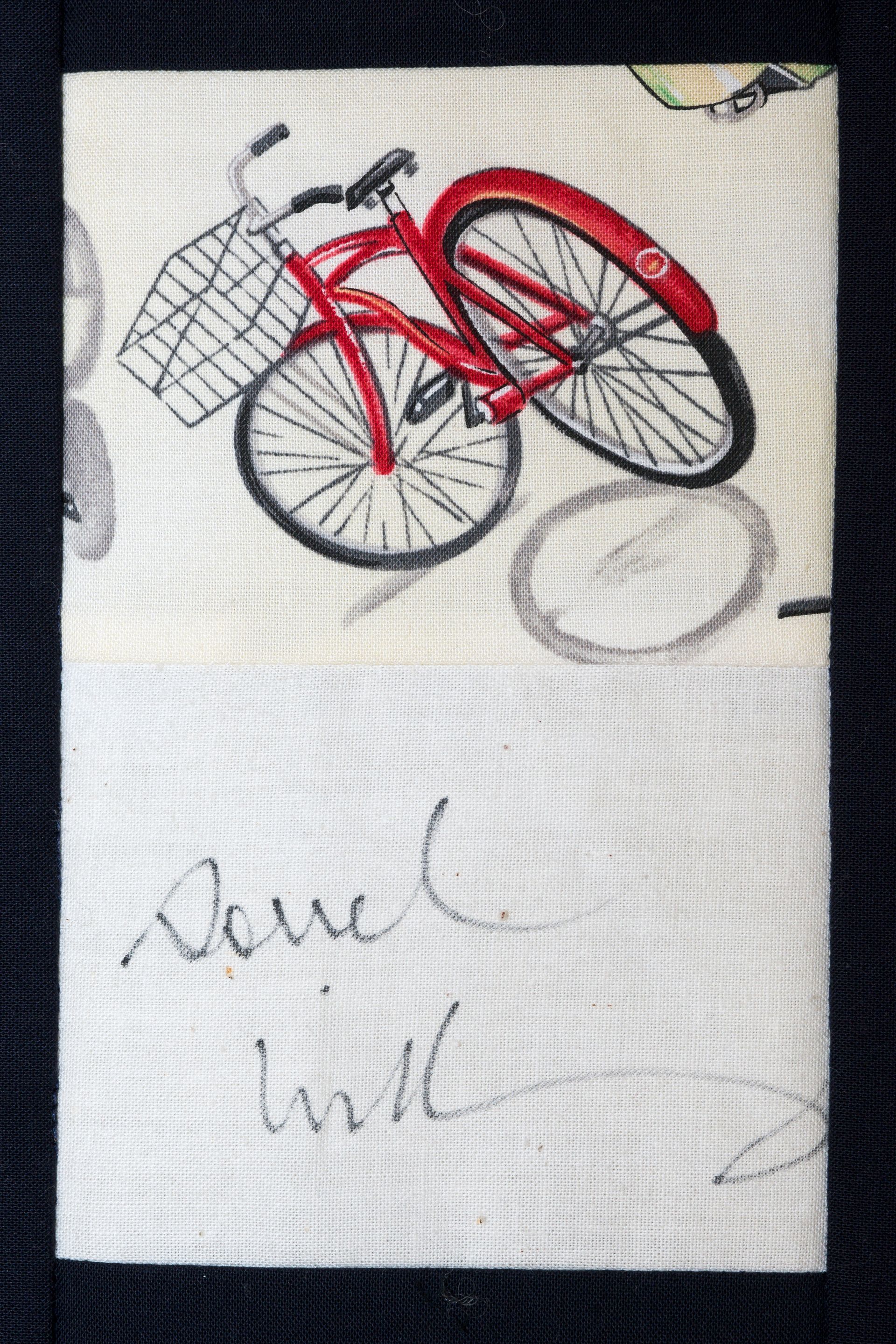 Red bicycle with a front basket drawn on white paper, with faint handwritten notes below.
