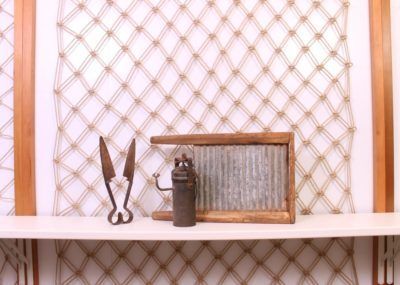 A pair of scissors sitting on top of a white shelf