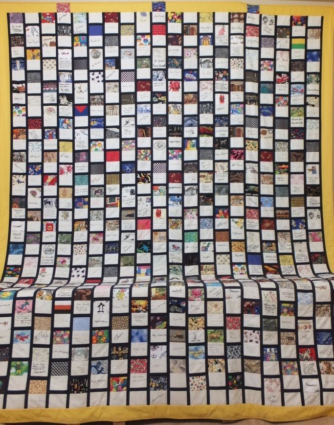 A quilt with a lot of squares on it