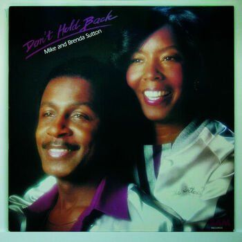 Album cover featuring two smiling adults on a dark background, titled “Don’t Hold Back”