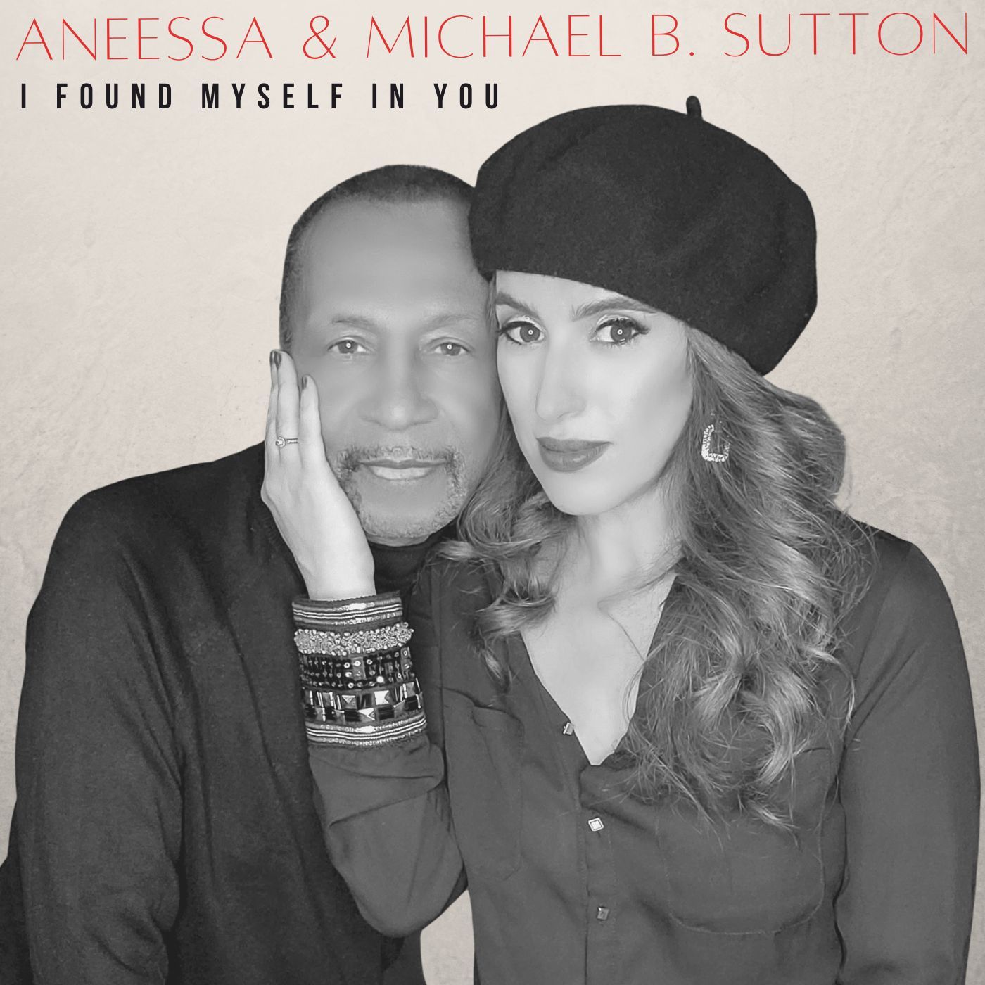 Black-and-white portrait of two people posing closely, with “I FOUND MYSELF IN YOU” text above.