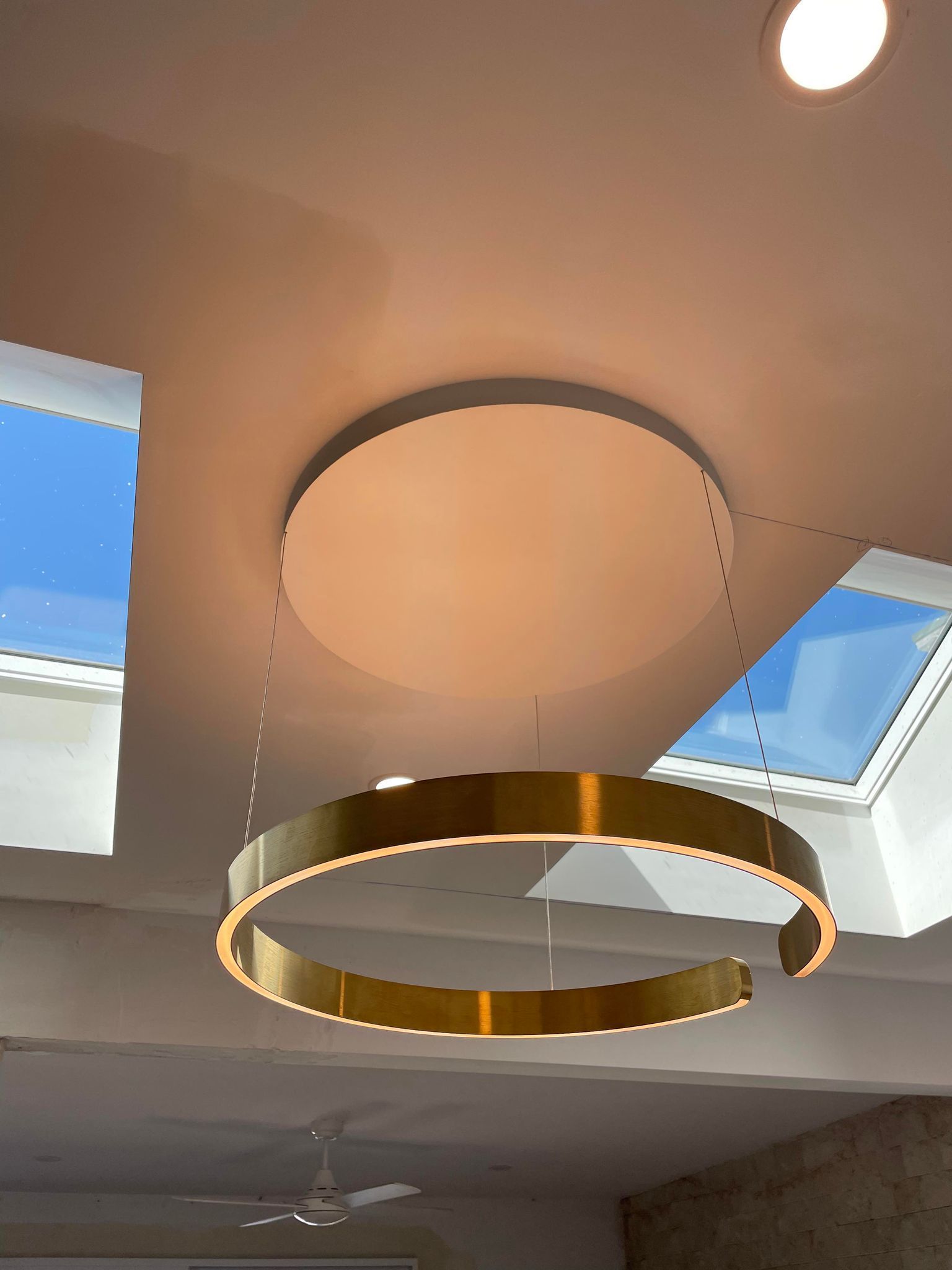 A Modern Light Fixture Hanging From The Ceiling — TB Electrical & Communications in West Gosford, NSW