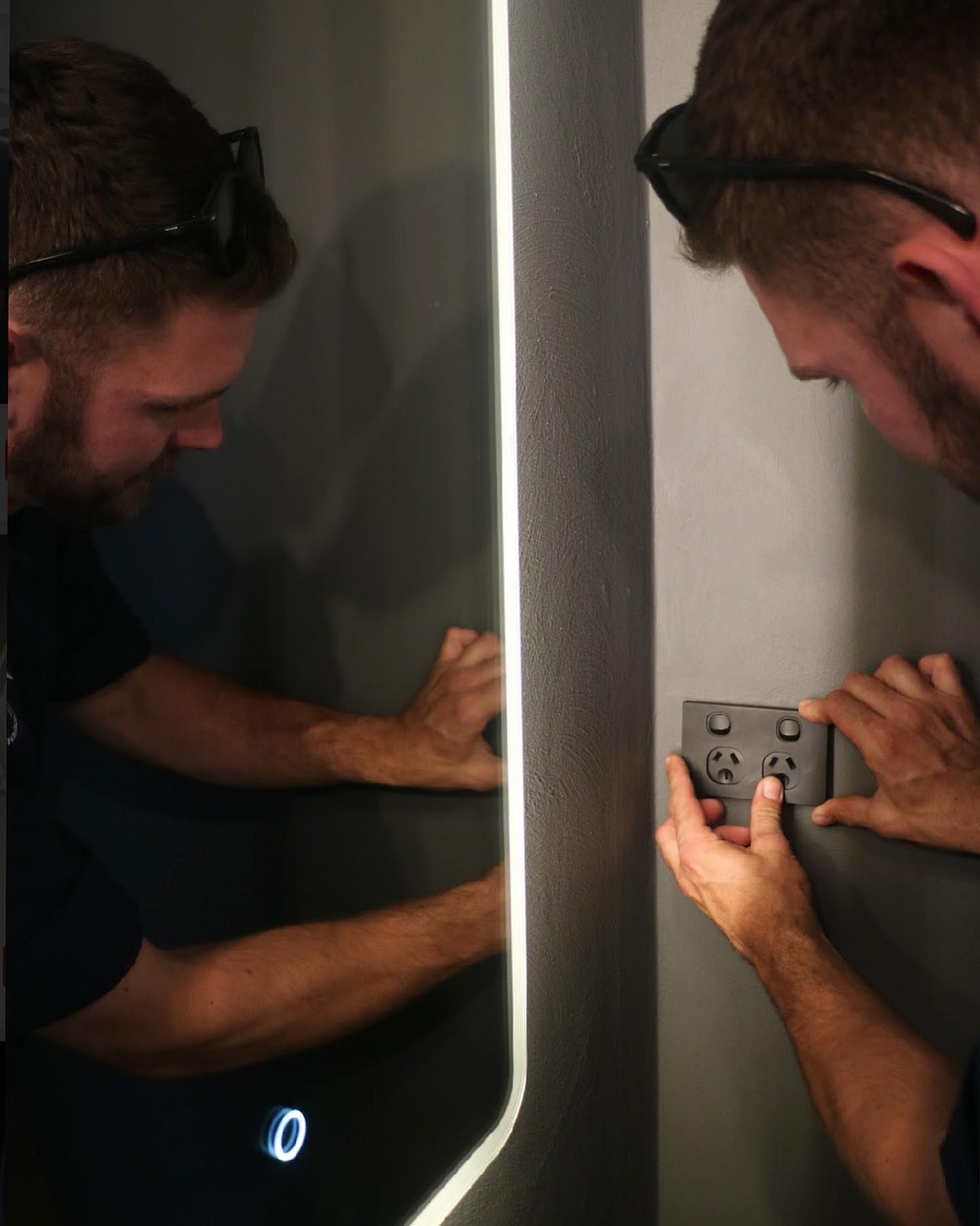 Electrician Adjusting Light Switch — TB Electrical & Communications in West Gosford, NSW