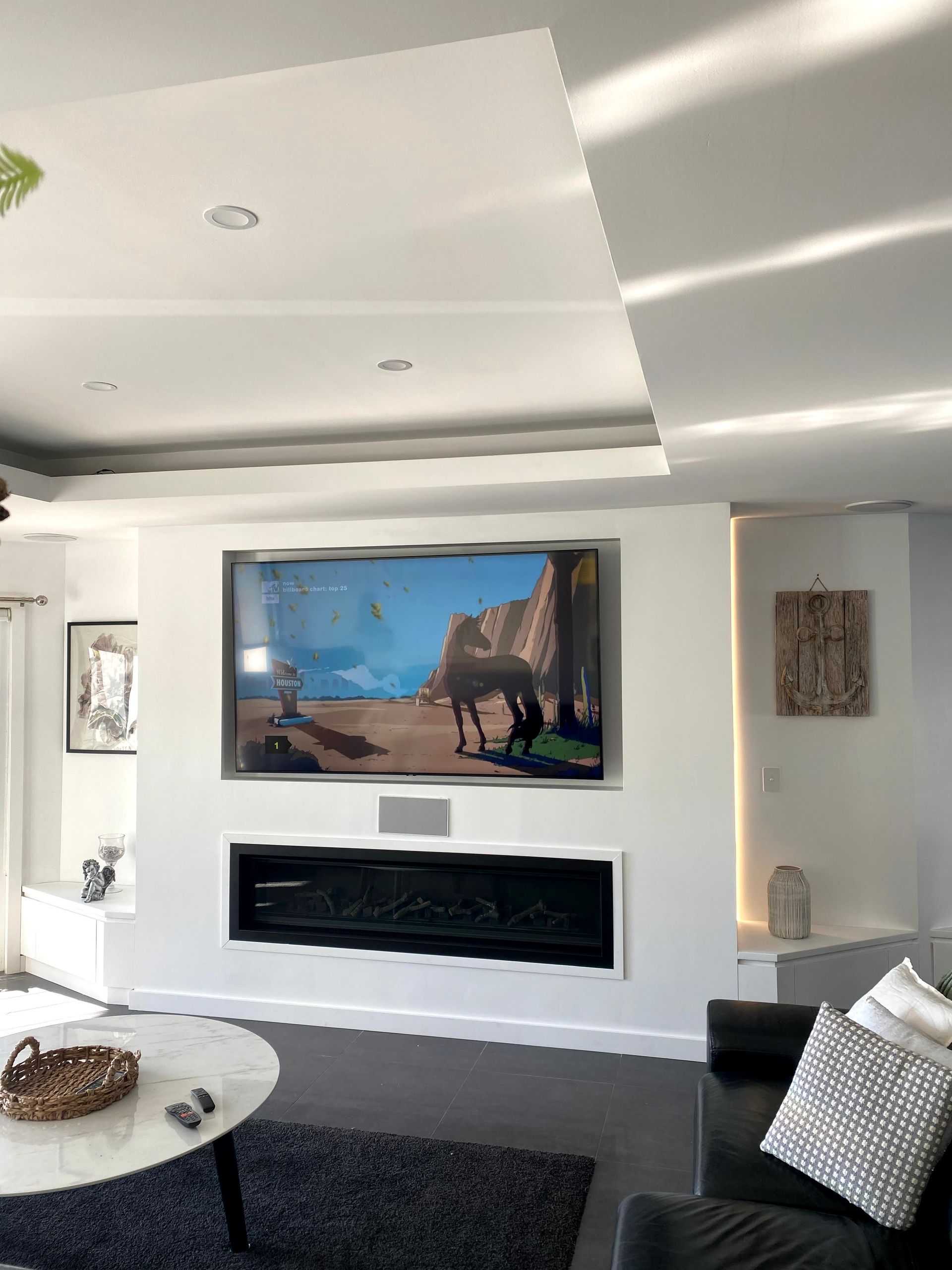 A Living Room With A Large TV On The Wall — TB Electrical & Communications in West Gosford, NSW