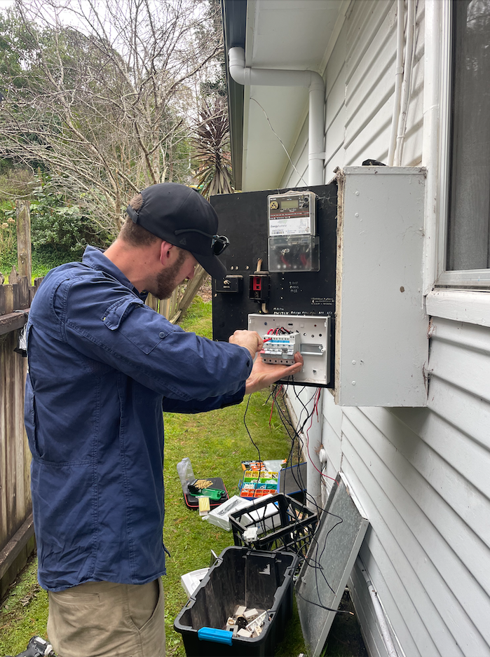 Young Electrician At Work Measure The Voltage Of A Residential Electrical Installation — TB Electrical & Communications in West Gosford, NSW