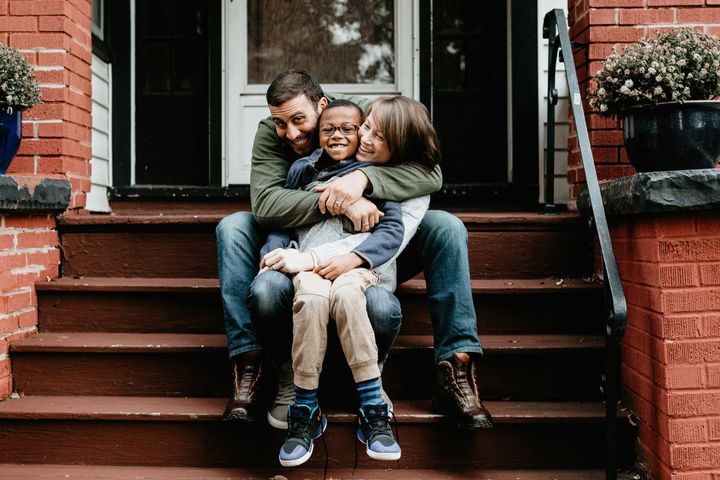 Family hugging and sitting on a porch — Greeneville, TN — Chesnut Law Office Family hugging and sitting on a porch — Greeneville, TN — Chesnut Law Office