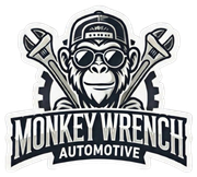 Monkey Wrench Automotive logo with a monkey in goggles and cap over crossed wrenches