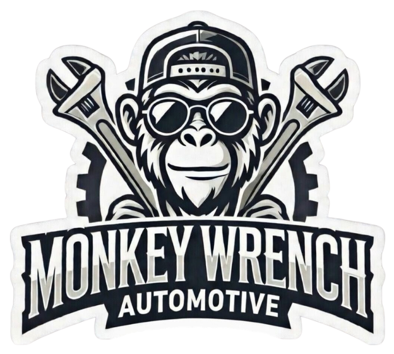 Monkey Wrench Automotive logo with a monkey in goggles and cap over crossed wrenches