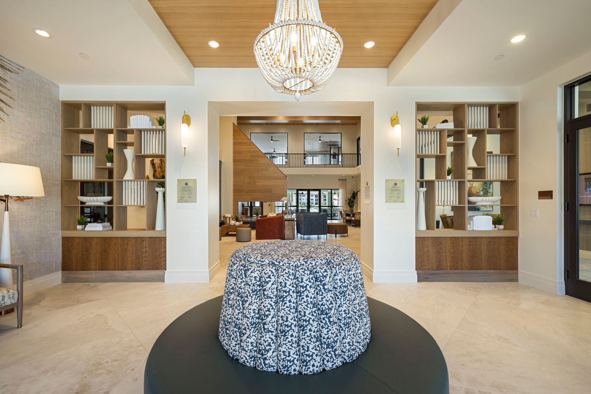 There is a large chandelier in the middle of the room at Corsa at Estero Crossing.