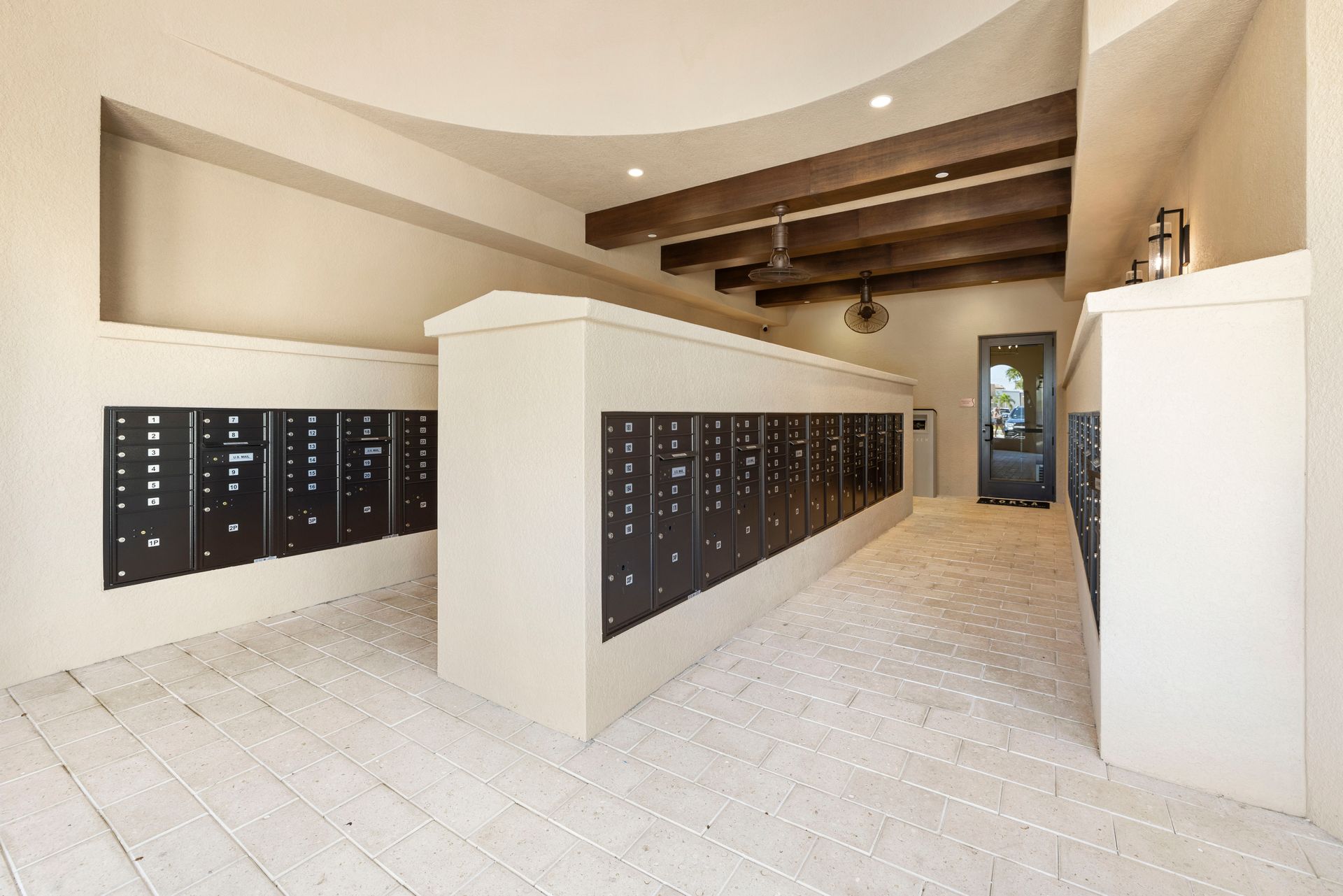 A room with a lot of mailboxes on the wall at Corsa at Estero Crossing.