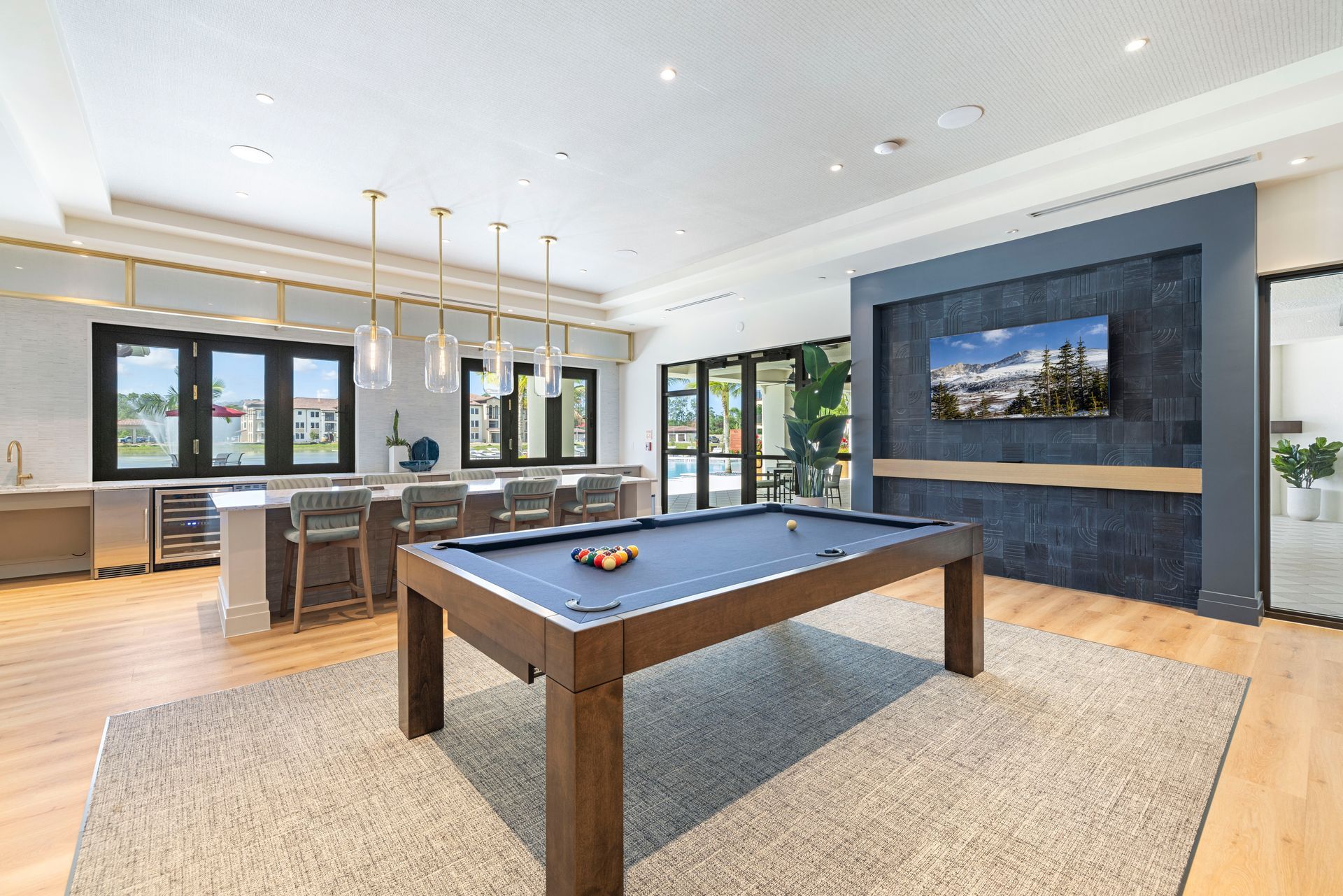 There is a pool table in the middle of the room at Corsa at Estero Crossing.