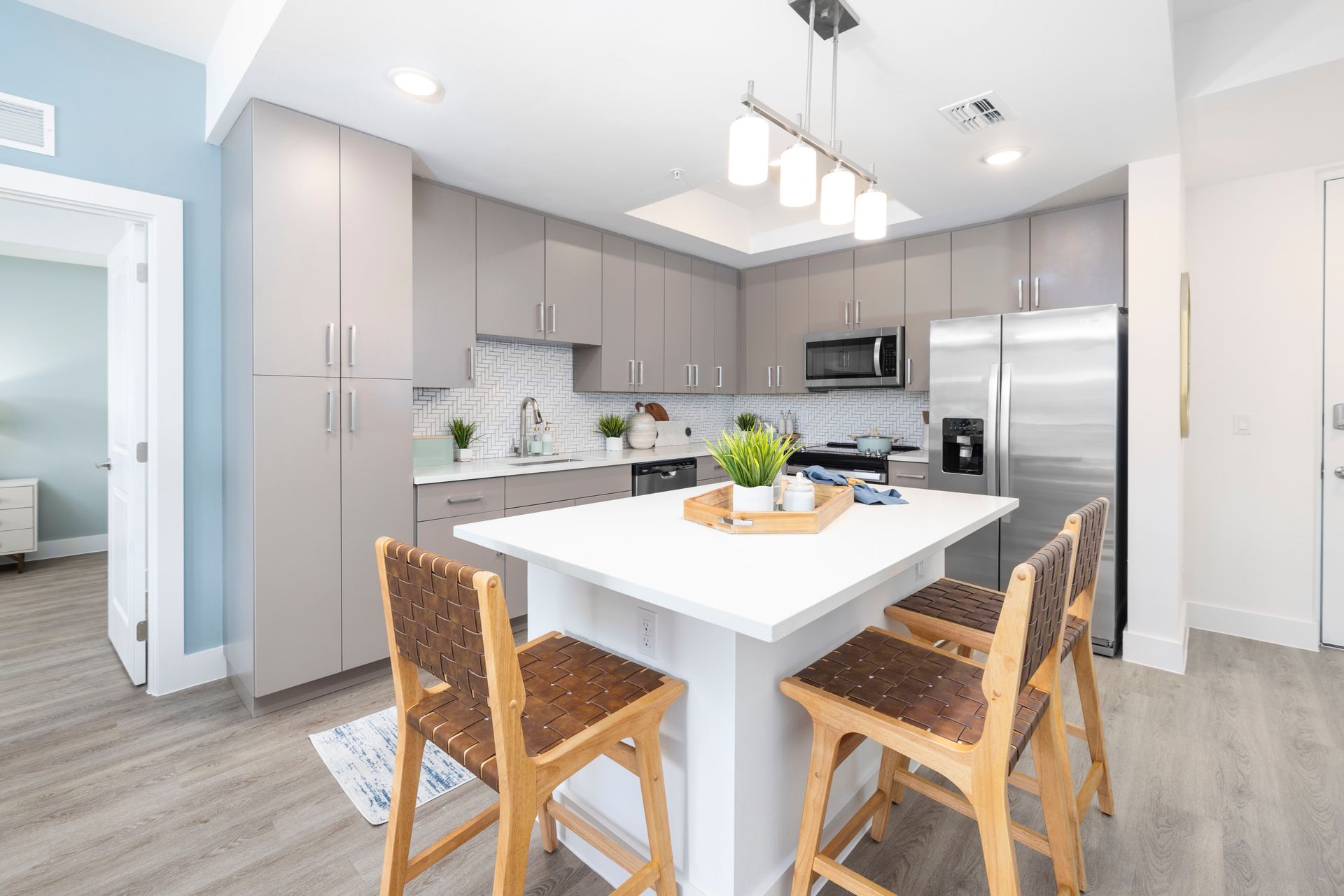 A kitchen with a table and chairs in it at Corsa at Estero Crossing.