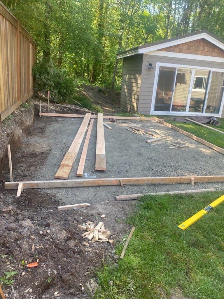A house is being built in the backyard of a house.
