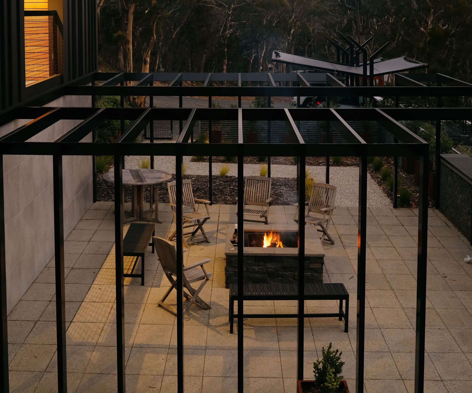 A patio with a fire pit in the middle of it