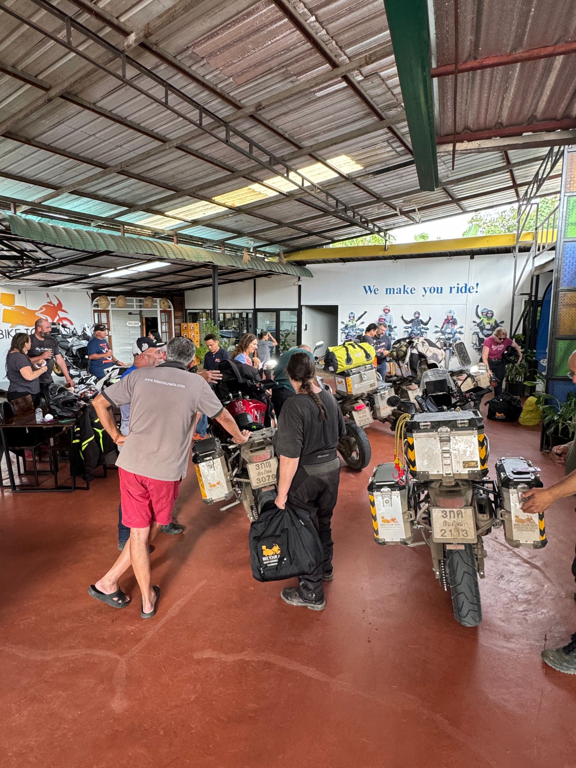 Motorbike group stop at Wachirathan Waterfall in Doi Inthanon National Park Thailand