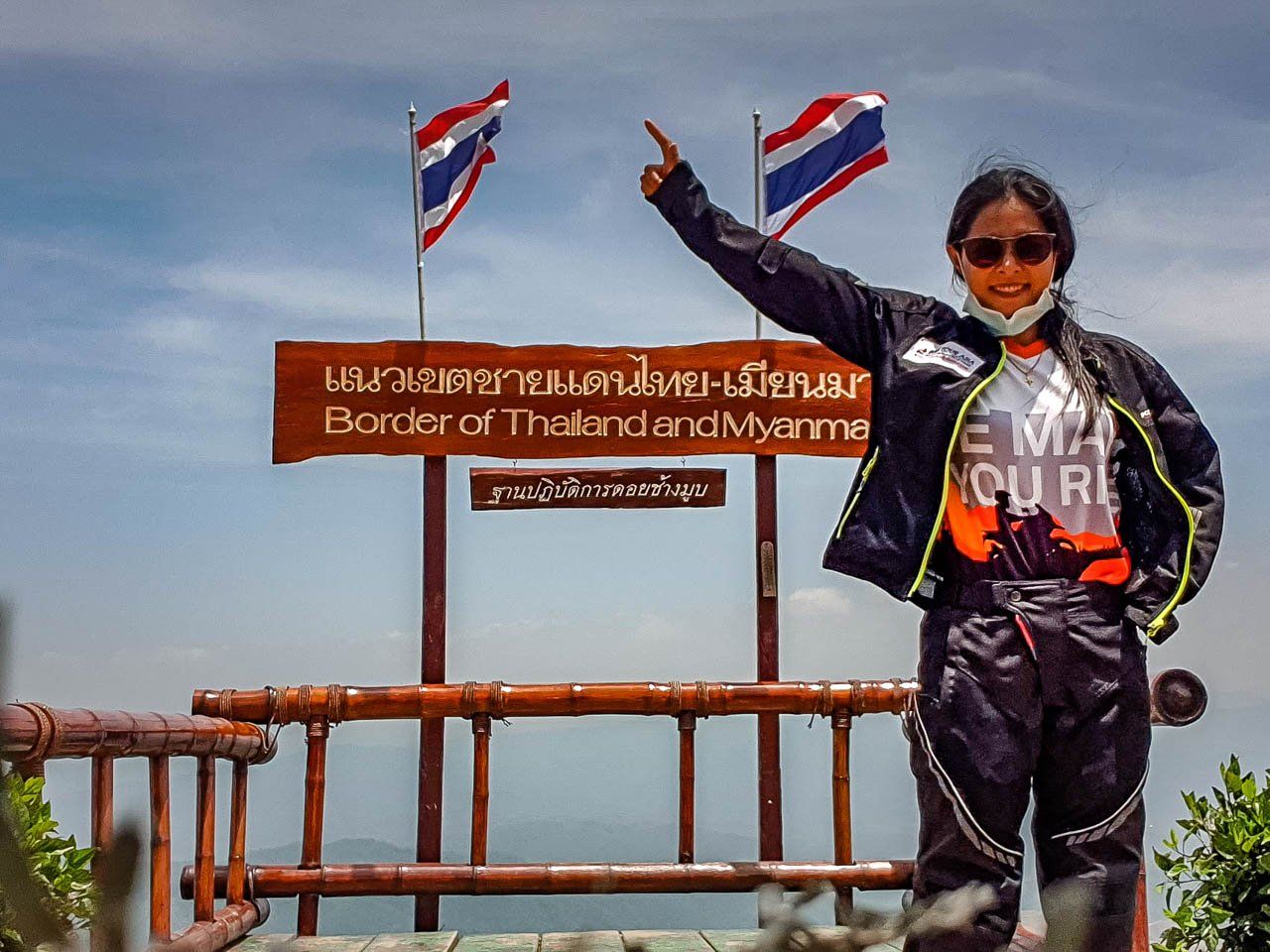 Female motorbike rider posing at the Thailand and Myanmar border viewpoint in Mae Hong Son