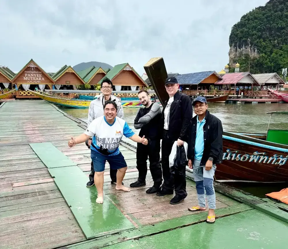 Bike Tour Asia riders visiting the floating village of Koh Panyee in Phang Nga Bay, Thailand
