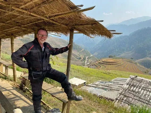 Rider enjoying panoramic rice terrace views in northern Vietnam