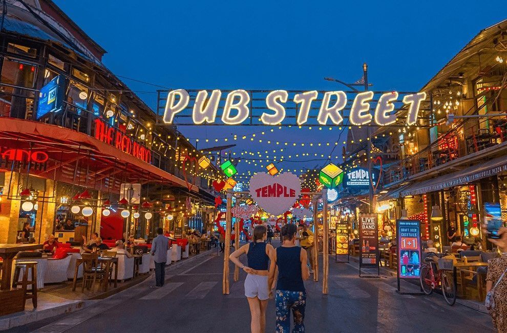 Vibrant night scene on Pub Street in Siem Reap, Cambodia, with restaurants and live music