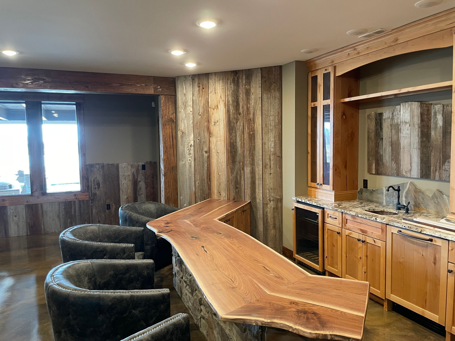A Home Wet Bar With Wooden Countertops By Design Built Homes in Columbia, MO.