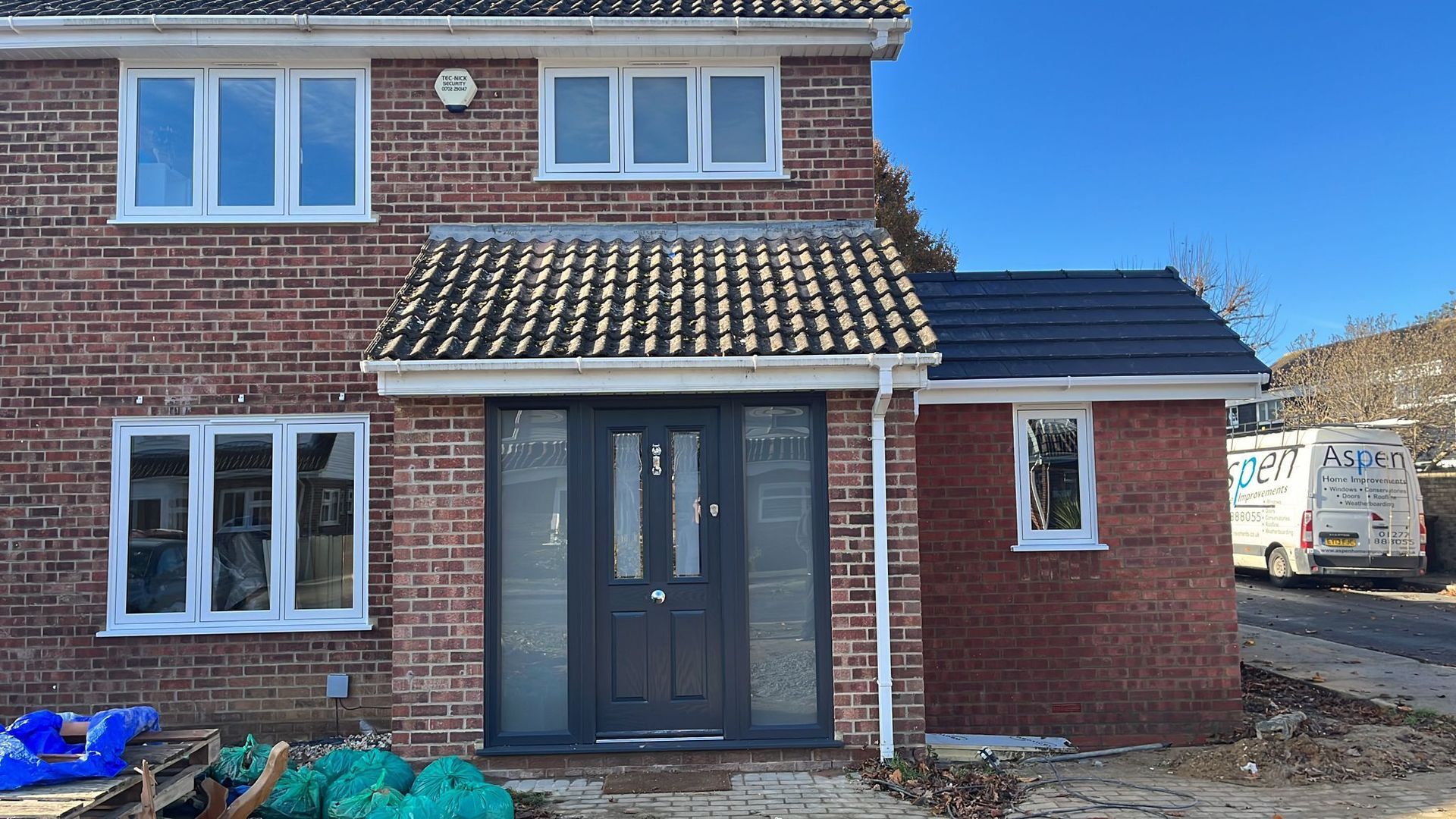 White double glazed windows and grey door
