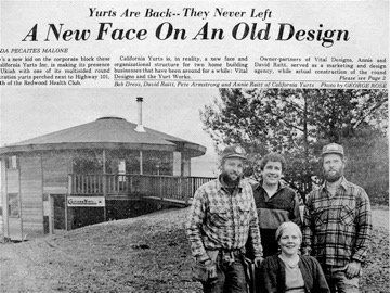 Newspaper clipping showing a round building and four people posing outside on a grassy slope