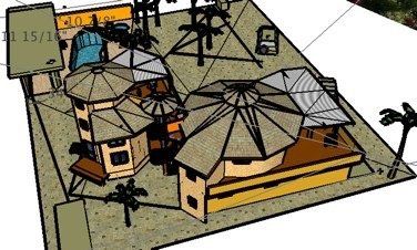 Top-down view of a modern house with tan roofs, a driveway, and surrounding yard and palm trees.