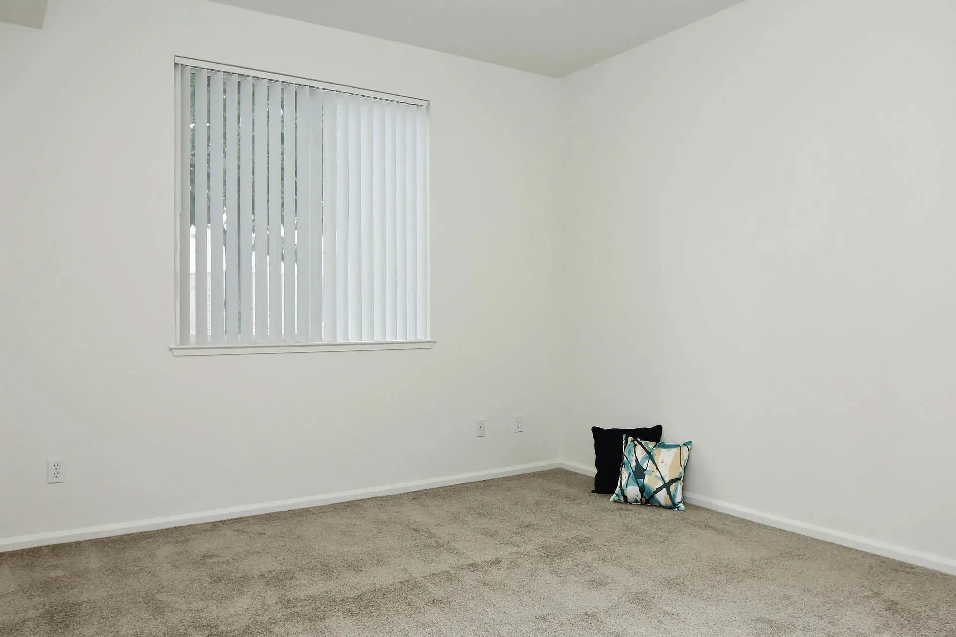 Thumbnail 25 of 51 - A room with a window and a pillow on the floor.