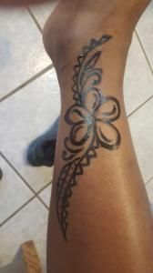 A close up of a person 's leg with a tattoo on it.