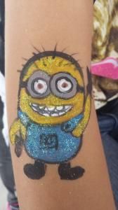 A person has a minion tattoo on their arm.