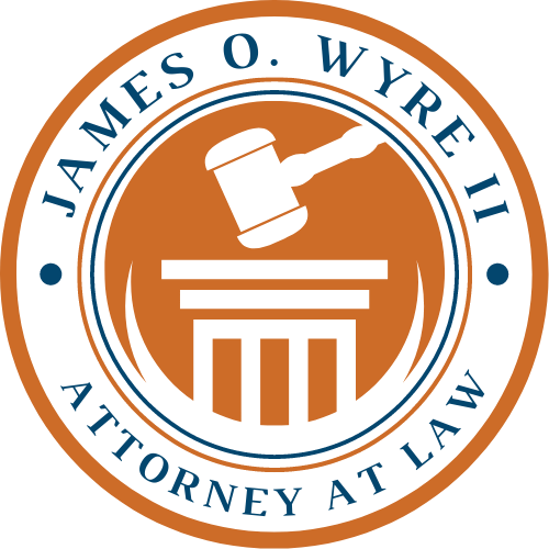 James O. Wyre II Attorney at Law circular logo with orange gavel and courthouse icon