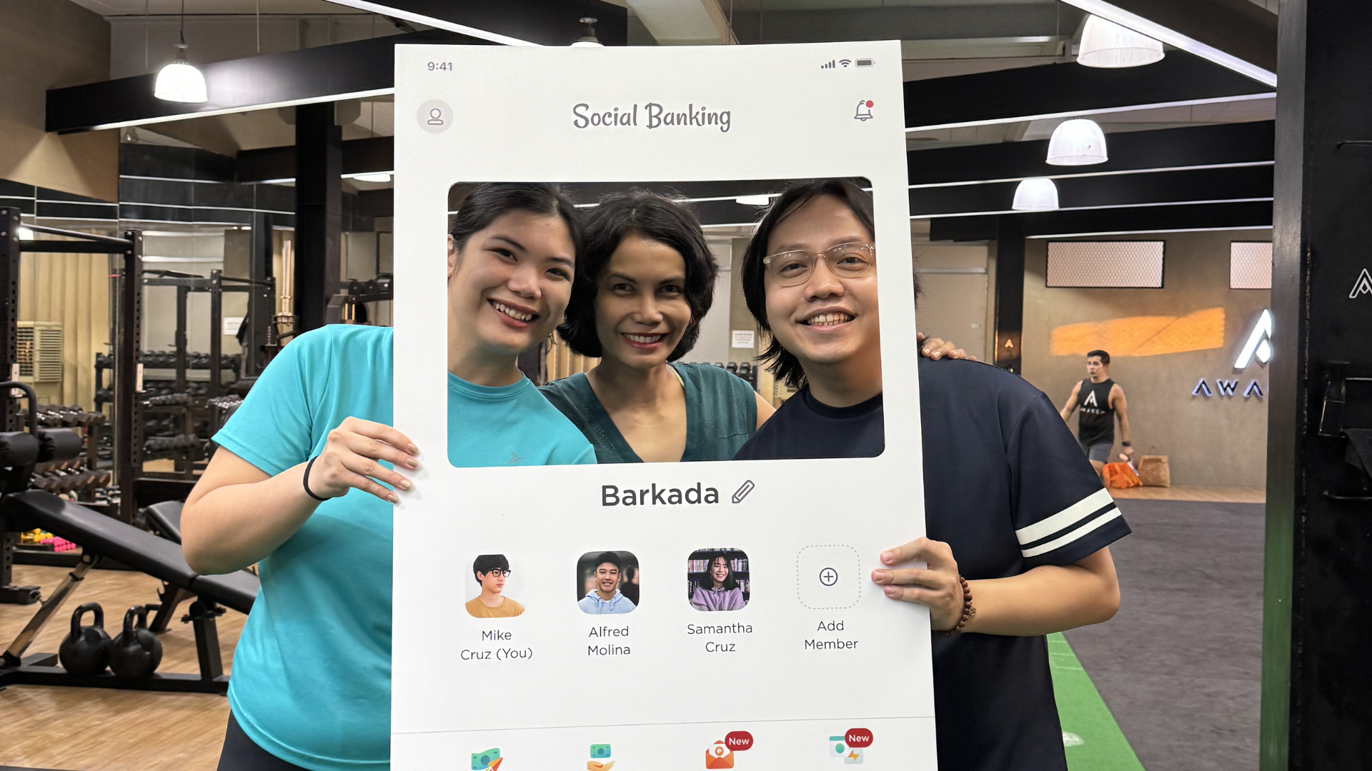 Three people holding a poster with a photo collage in an indoor office setting.