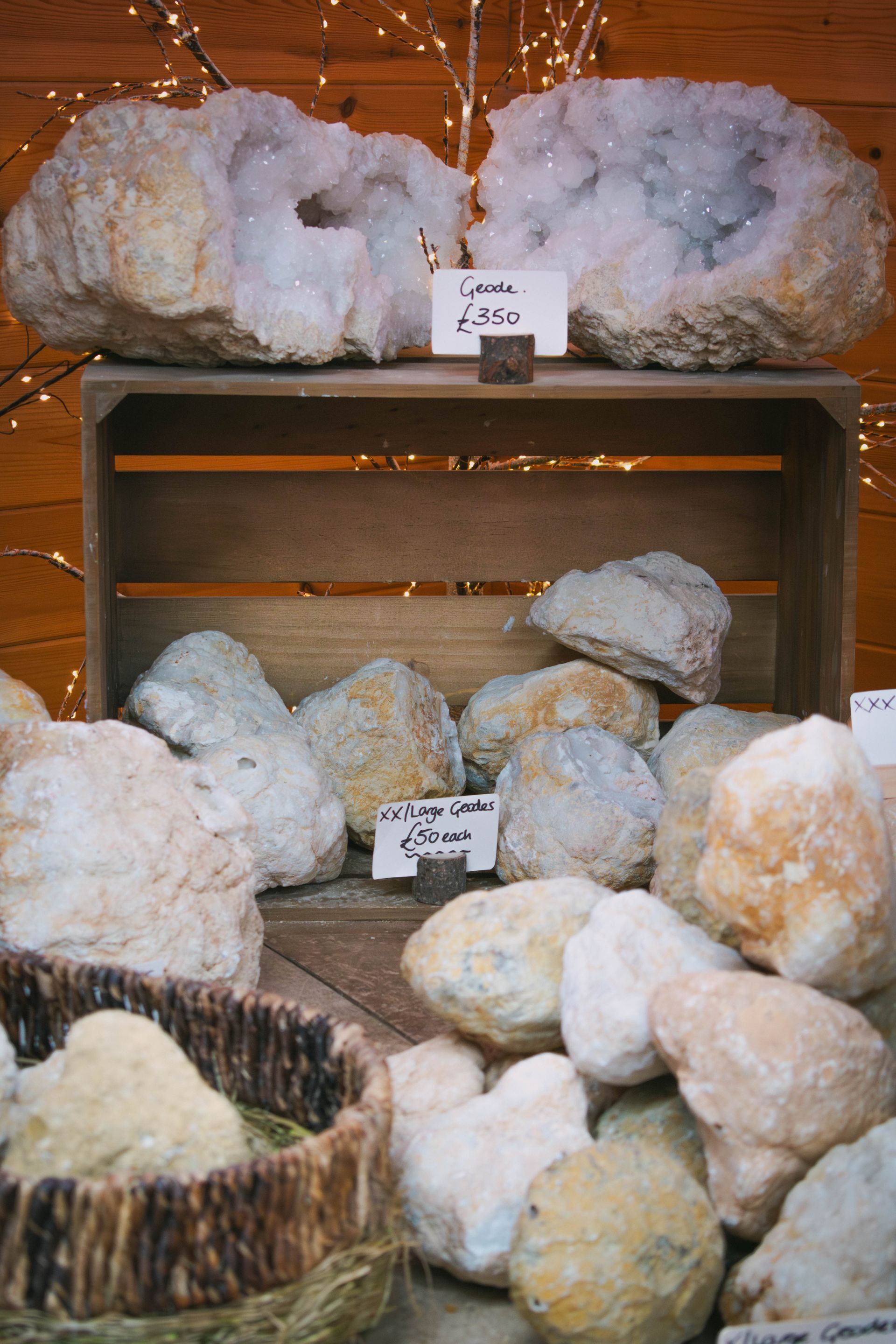 Close-up of a pile of rough, beige-colored geode rocks with crystalline surfaces.