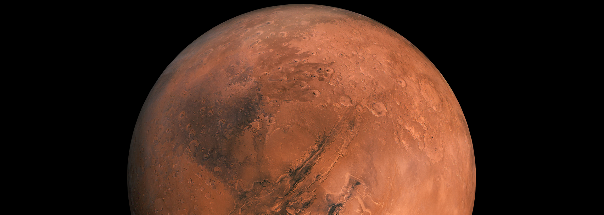 Mars, the red planet, against a black background.