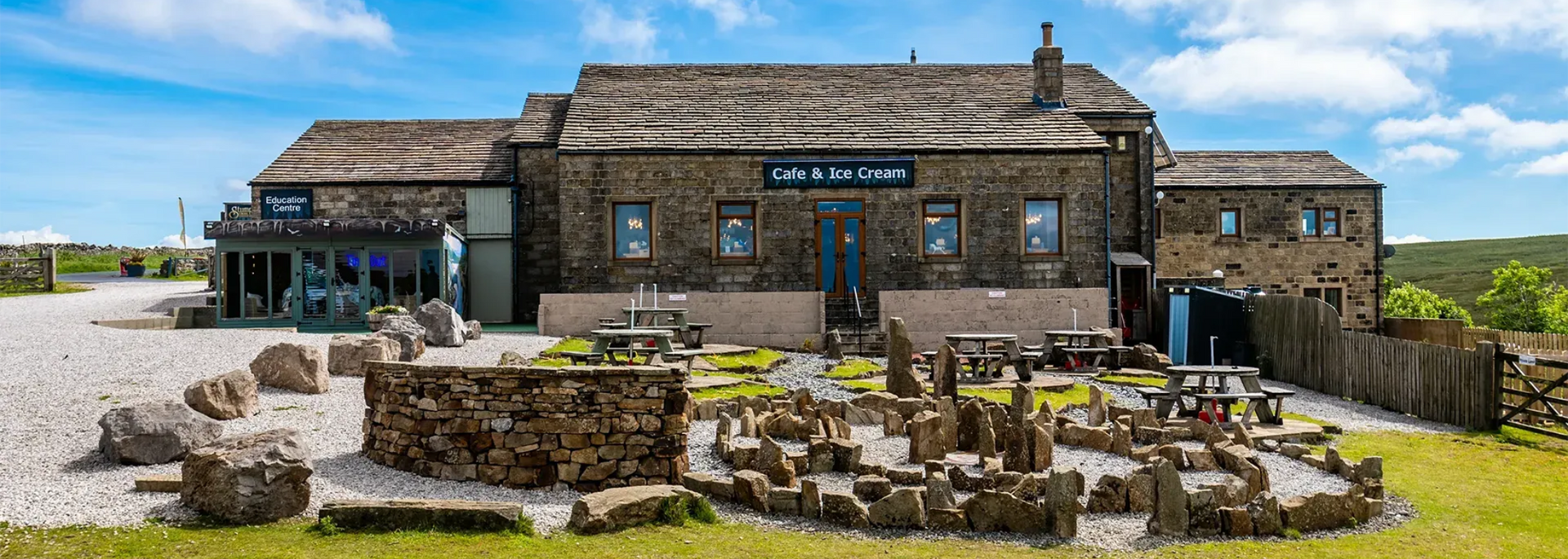A stone building with a sign that says 