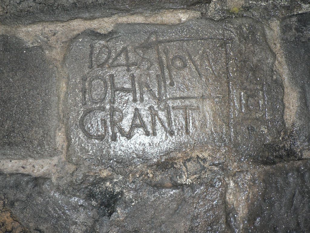 Stone with engraved text: 
