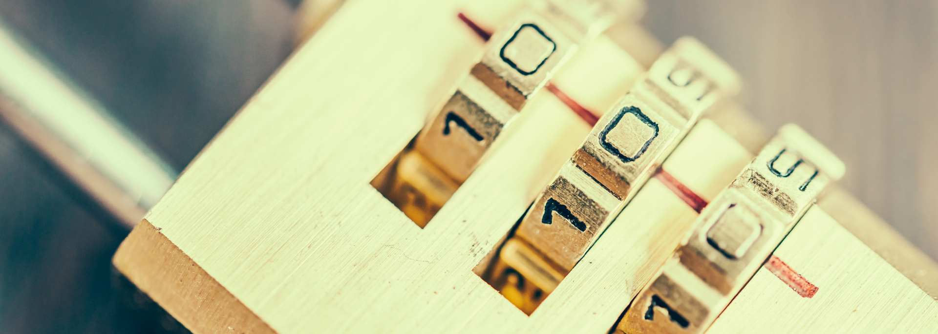 Close-up of a combination lock with the numbers 7, 0, and 5 visible.