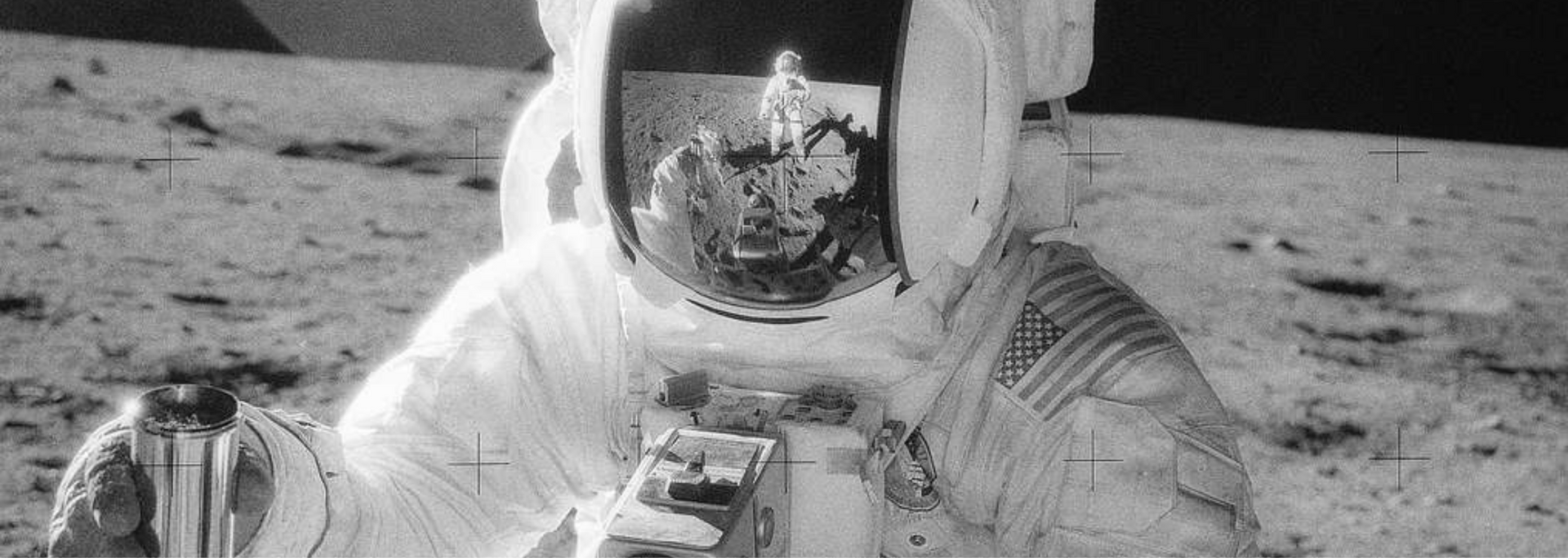 Astronaut on the moon, helmet reflecting the lunar surface and another astronaut. American flag on spacesuit.