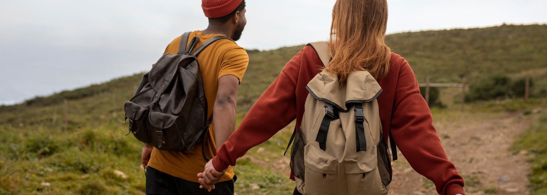 Picture of a couple walking with backpacks. Picture of a couple walking with backpacks.